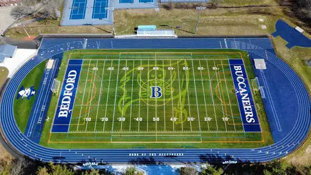 Bedford Public Schools new synthetic turf field at Bedford High School featuring safety shock pads and organic infill.